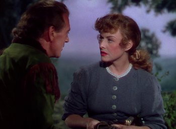 Movie still from “Unconquered” (1947), directed by Cecil B. DeMille – A man and a woman talking to each other; Medium shot, Over the shoulder angle