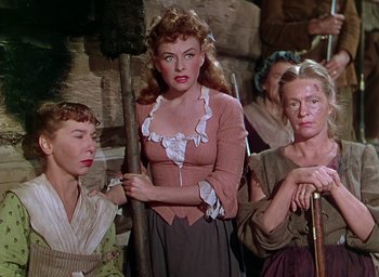 Movie still from “Unconquered” (1947), directed by Cecil B. DeMille – A group of women standing next to each other in a room; Medium shot, Low angle