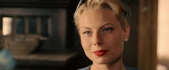 Movie still from “Under the Sun” (1998), directed by Colin Nutley – A person with blonde hair and blue eyes; Close Up shot, Over the shoulder angle