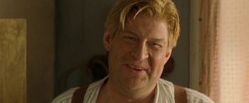 Movie still from “Under the Sun” (1998), directed by Colin Nutley – A person with blonde hair; Close Up shot, Low angle