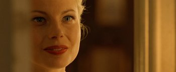 Movie still from “Under the Sun” (1998), directed by Colin Nutley – A woman's face with red lipstick; Close Up shot, Over the shoulder angle