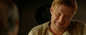 Movie still from “Under the Sun” (1998), directed by Colin Nutley – A person with blond hair; Close Up shot, Over the shoulder angle