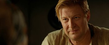 Movie still from “Under the Sun” (1998), directed by Colin Nutley – A person with blonde hair; Close Up shot, Over the shoulder angle