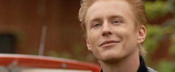 Movie still from “Under the Sun” (1998), directed by Colin Nutley – A person with blonde hair; Close Up shot, Over the shoulder angle