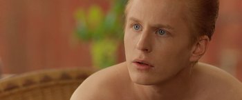 Movie still from “Under the Sun” (1998), directed by Colin Nutley – A person with blue eyes; Close Up shot, Over the shoulder angle