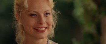 Movie still from “Under the Sun” (1998), directed by Colin Nutley – A woman's face with blue eyes; Close Up shot, Over the shoulder angle