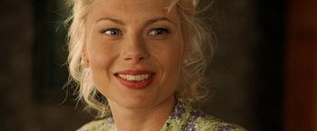 Movie still from “Under the Sun” (1998), directed by Colin Nutley – A woman's face with blue eyes; Close Up shot, Over the shoulder angle