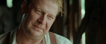 Movie still from “Under the Sun” (1998), directed by Colin Nutley – A person with blonde hair; Close Up shot, Low angle