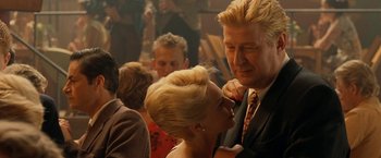 Movie still from “Under the Sun” (1998), directed by Colin Nutley – A man and a woman are dancing in a crowd; Close Up shot, Over the shoulder angle