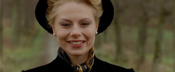 Movie still from “Under the Sun” (1998), directed by Colin Nutley – A person wearing a hat; Close Up shot, Over the shoulder angle