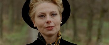 Movie still from “Under the Sun” (1998), directed by Colin Nutley – A person wearing a hat; Close Up shot, Over the shoulder angle