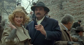 Movie still from “Underground” (1995), directed by Emir Kusturica – A man wearing a hat and a coat; Medium shot, Low angle