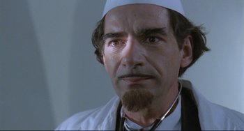 Movie still from “Underground” (1995), directed by Emir Kusturica – A person with a beard; Close Up shot, Low angle