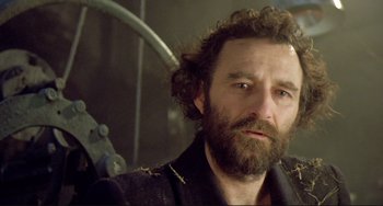 Movie still from “Underground” (1995), directed by Emir Kusturica – A person with a beard; Close Up shot, Low angle
