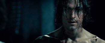 Movie still from “Underworld: Awakening” (2012), directed by Björn Stein – A man's face with blood on his face; Close Up shot, Over the shoulder angle