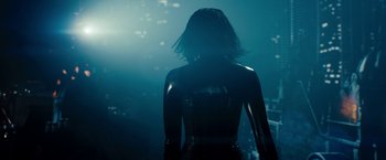 Movie still from “Underworld: Awakening” (2012), directed by Björn Stein – A woman standing in the dark wearing a black outfit; Medium shot, Over the shoulder angle