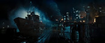 Movie still from “Underworld: Awakening” (2012), directed by Björn Stein – A city lit up at night with smoke coming out of the sky; Extreme Wide shot, High angle