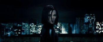 Movie still from “Underworld: Awakening” (2012), directed by Björn Stein – A person wearing a black outfit; Close Up shot, Low angle