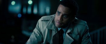 Movie still from “Underworld: Awakening” (2012), directed by Björn Stein – A man wearing a trench coat and tie; Close Up shot, High angle