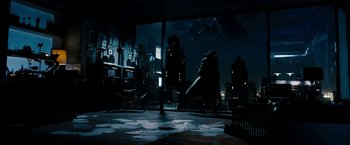 Movie still from “Underworld: Awakening” (2012), directed by Björn Stein – A man holding a baseball bat while standing in front of a window; Wide shot, High angle