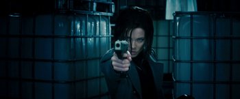 Movie still from “Underworld: Awakening” (2012), directed by Björn Stein – A woman is holding a gun in her hand; Close Up shot, Low angle