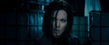 Movie still from “Underworld: Awakening” (2012), directed by Björn Stein – A person with long hair; Close Up shot, Over the shoulder angle