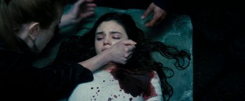 Movie still from “Underworld: Awakening” (2012), directed by Björn Stein – A woman with blood all over her face and hands; Close Up shot, Overhead angle