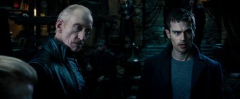Movie still from “Underworld: Awakening” (2012), directed by Björn Stein – Two men in black suits are standing next to each other; Close Up shot, Over the shoulder angle
