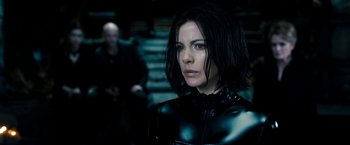 Movie still from “Underworld: Awakening” (2012), directed by Björn Stein – A person wearing a leather outfit; Close Up shot, Over the shoulder angle