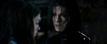 Movie still from “Underworld: Awakening” (2012), directed by Björn Stein – A person in a dark room; Close Up shot, Over the shoulder angle