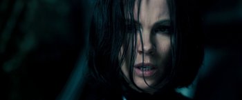 Movie still from “Underworld: Awakening” (2012), directed by Björn Stein – A person with long hair; Close Up shot, Over the shoulder angle