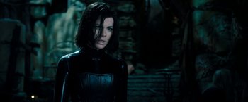 Movie still from “Underworld: Awakening” (2012), directed by Björn Stein – A person wearing a black outfit; Medium shot, Over the shoulder angle