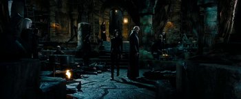 Movie still from “Underworld: Awakening” (2012), directed by Björn Stein – A group of people standing around in a dark place; Wide shot, High angle