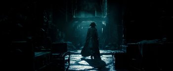 Movie still from “Underworld: Awakening” (2012), directed by Björn Stein – A man in a long black coat and a hat; Wide shot, Low angle