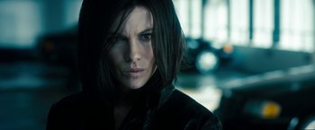 Movie still from “Underworld: Awakening” (2012), directed by Björn Stein – A person wearing a black jacket; Close Up shot, Low angle
