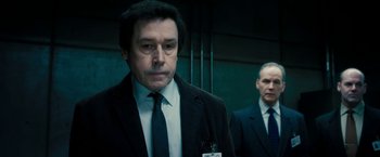 Movie still from “Underworld: Awakening” (2012), directed by Björn Stein – A man in a suit and tie standing next to another man in a suit and tie; Close Up shot, Low angle