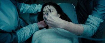 Movie still from “Underworld: Awakening” (2012), directed by Björn Stein – A woman getting her teeth cleaned by a dentist; Close Up shot, Overhead angle