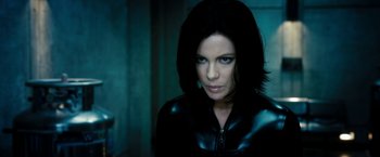Movie still from “Underworld: Awakening” (2012), directed by Björn Stein – A person wearing a leather jacket; Close Up shot, Low angle