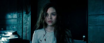 Movie still from “Underworld: Awakening” (2012), directed by Björn Stein – A young girl with blood all over her face; Close Up shot, High angle