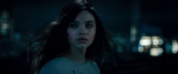 Movie still from “Underworld: Awakening” (2012), directed by Björn Stein – A woman with a blood splattered face in a dark room; Close Up shot, Over the shoulder angle