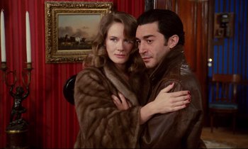 Movie still from “A Room in Town” (1982), directed by Jacques Demy – A man and a woman posing for a picture; Close Up shot, Low angle