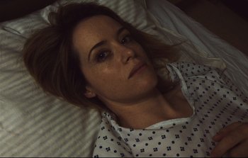 Movie still from “Unsane” (2018), directed by Steven Soderbergh – A person laying in a bed; Close Up shot, Overhead angle
