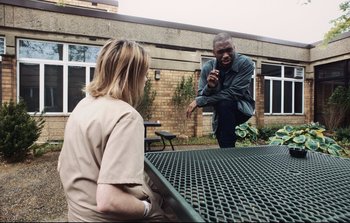 Movie still from “Unsane” (2018), directed by Steven Soderbergh – A man and a woman sitting at a table; Medium shot, Over the shoulder angle