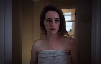 Movie still from “Unsane” (2018), directed by Steven Soderbergh – A woman with a towel around her shoulders; Close Up shot, Low angle