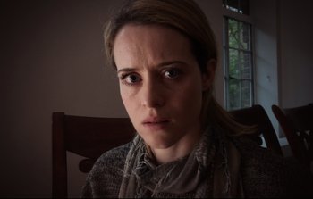 Movie still from “Unsane” (2018), directed by Steven Soderbergh – A person wearing a scarf; Close Up shot, Low angle