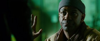 Movie still from “Unstoppable” (2010), directed by Tony Scott – A person holding his hand up; Close Up shot, Over the shoulder angle