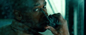 Movie still from “Unstoppable” (2010), directed by Tony Scott – A person talking on a cell phone; Extreme Close Up shot, Over the shoulder angle
