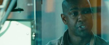 Movie still from “Unstoppable” (2010), directed by Tony Scott – A man's face as he looks out a window; Close Up shot, Over the shoulder angle