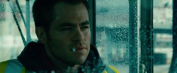 Movie still from “Unstoppable” (2010), directed by Tony Scott – A person looking out of a window; Close Up shot, Low angle