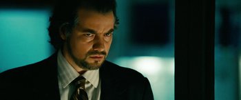 Movie still from “Unstoppable” (2010), directed by Tony Scott – A person wearing a suit and tie; Close Up shot, Low angle
